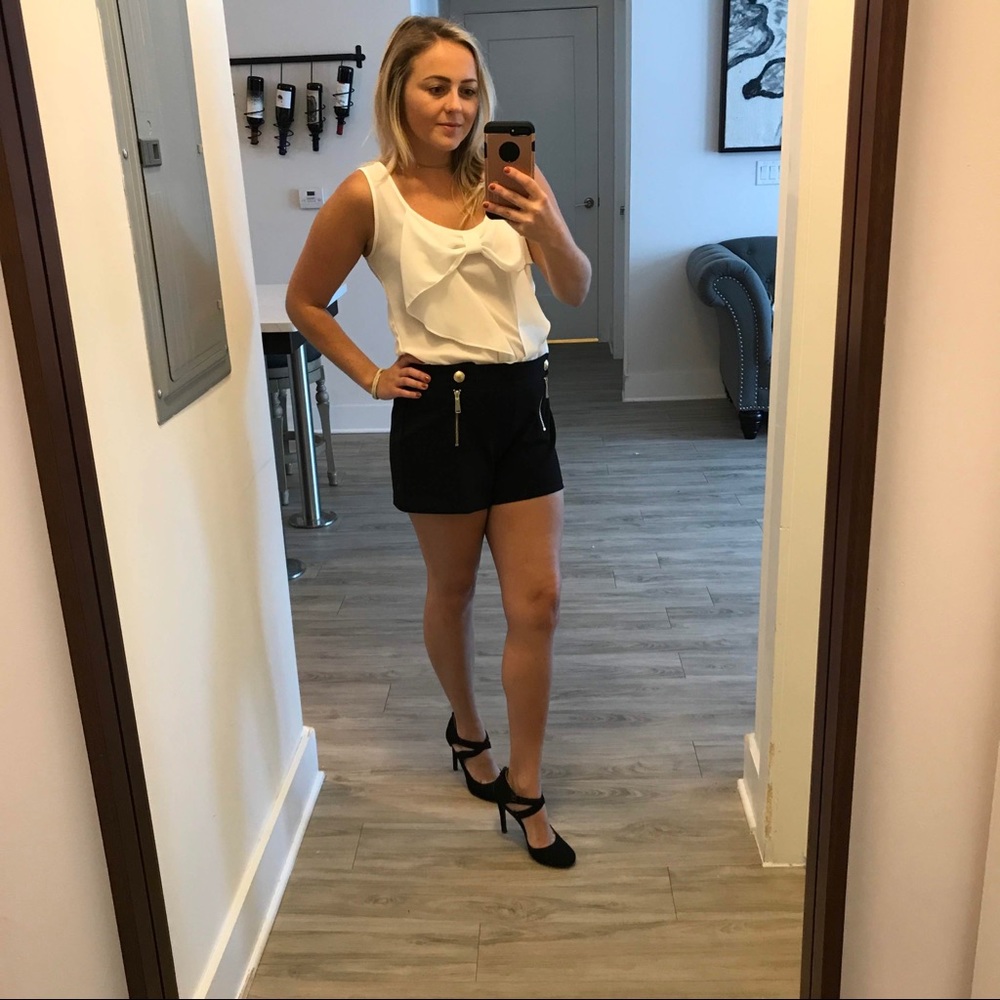 Cute white bow blouse and black dress shorts